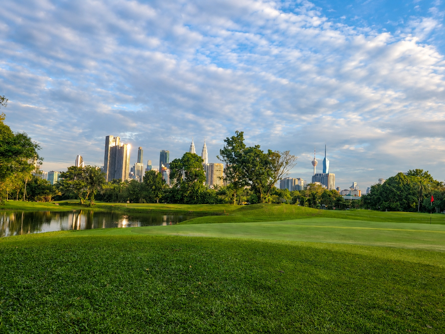 Hole 2 at KGTPDRM with the Kuala Lumpur skyline beyond
